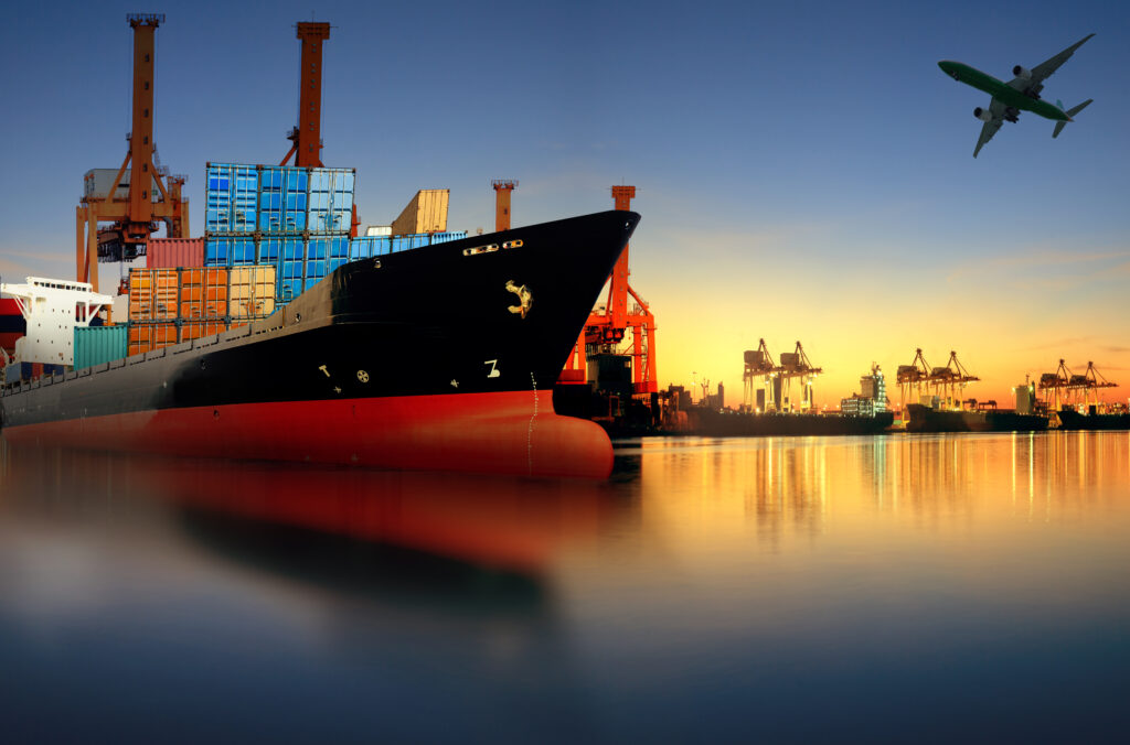 container ship in import,export port against beautiful morning light of loading ship yard use for freight and cargo shipping vessel transport